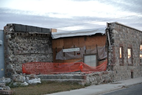 Deconstruction at rear of Stone Bank building in Bottineau, ND